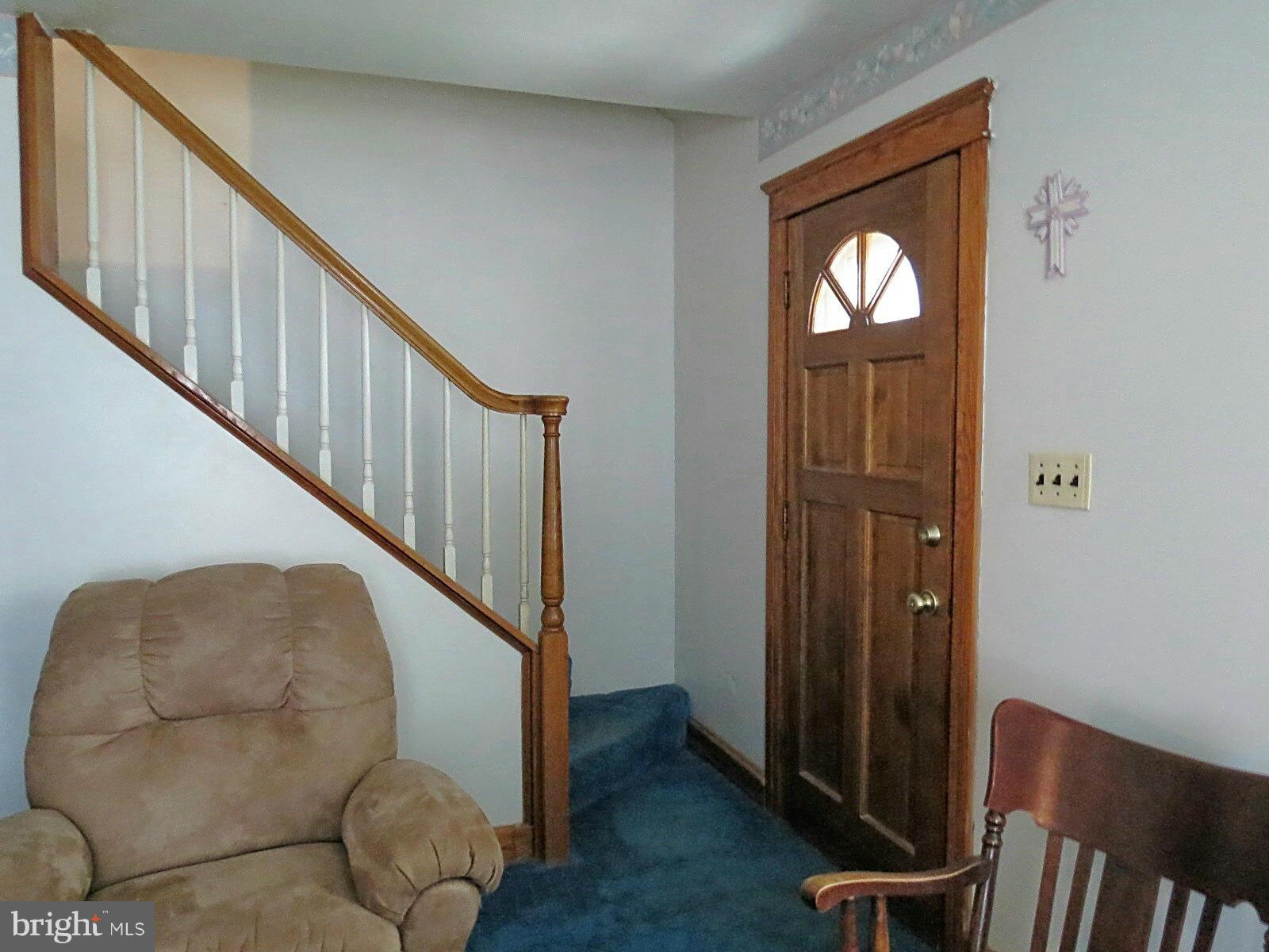 1650 Exeter Road Westminster, MD 21157 - Photo 4 of 18 a view of entryway with wooden floor and stairs