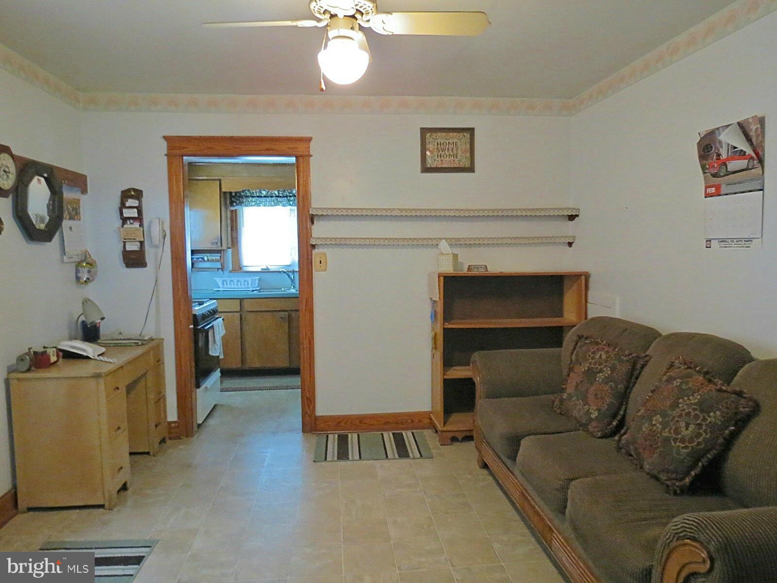 1650 Exeter Road Westminster, MD 21157 - Photo 6 of 18 a living room with furniture and a fireplace