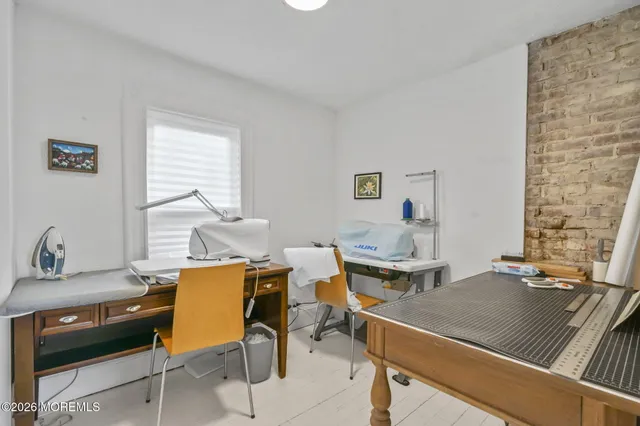 a workspace with furniture and a window