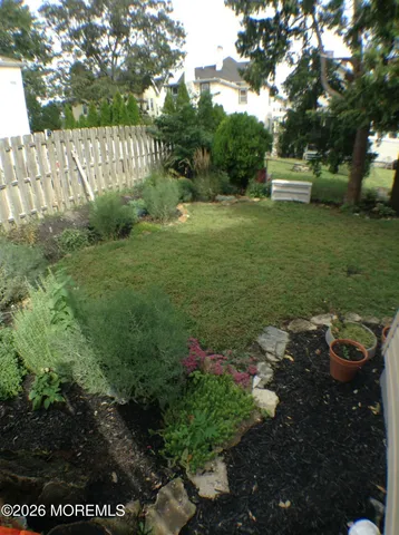 a view of a park with large trees