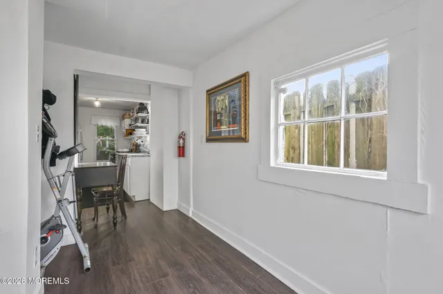 a view of a livingroom with furniture and a window