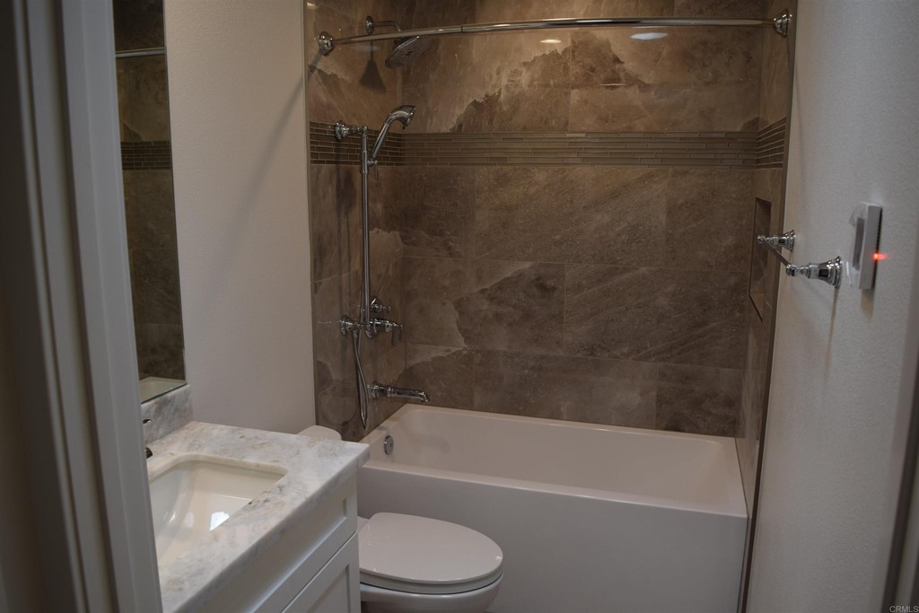 1723 Kellington Place Encinitas, CA 92024 - Photo 13 of 23 a bathroom with a granite countertop bathtub shower sink vanity and toilet