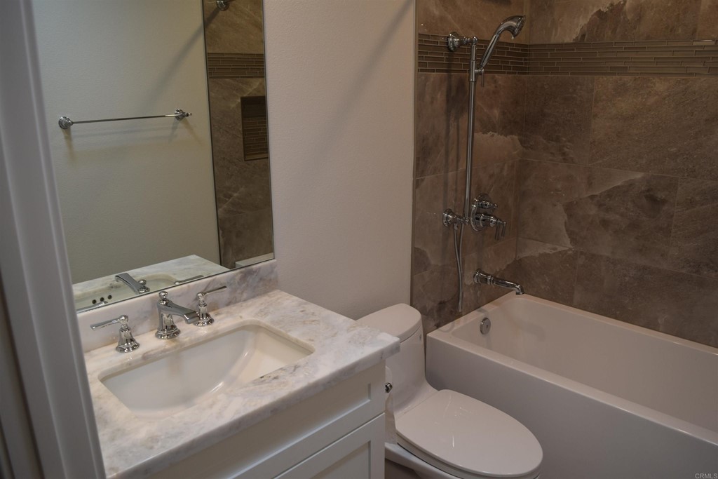 1723 Kellington Place Encinitas, CA 92024 - Photo 14 of 23 a bathroom with a sink toilet and shower