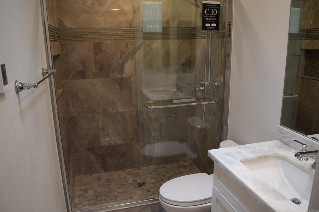 1723 Kellington Place Encinitas, CA 92024 - Photo 17 of 23 a bathroom with a sink toilet and shower