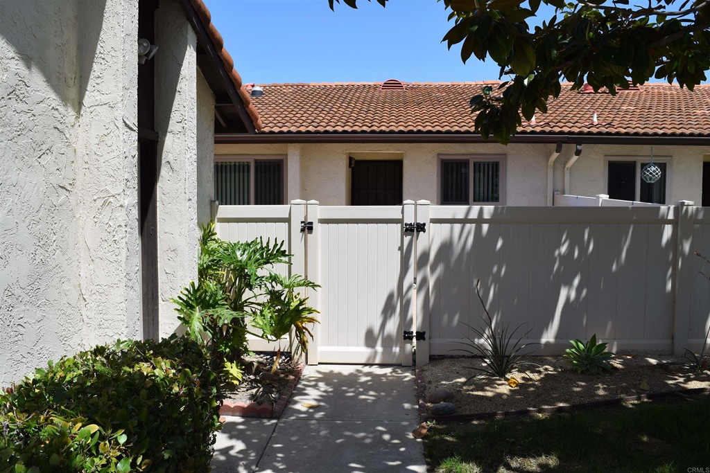 1723 Kellington Place Encinitas, CA 92024 - Photo 2 of 23 front view of a house with a yard