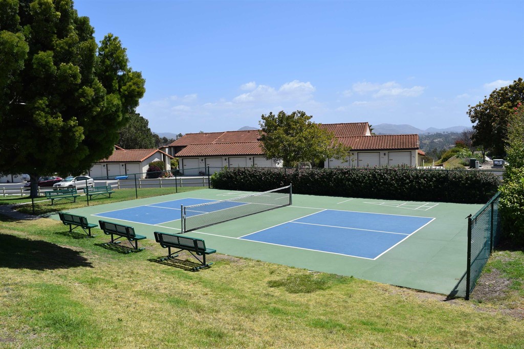 1723 Kellington Place Encinitas, CA 92024 - Photo 23 of 23 a view of a tennis ground with large trees