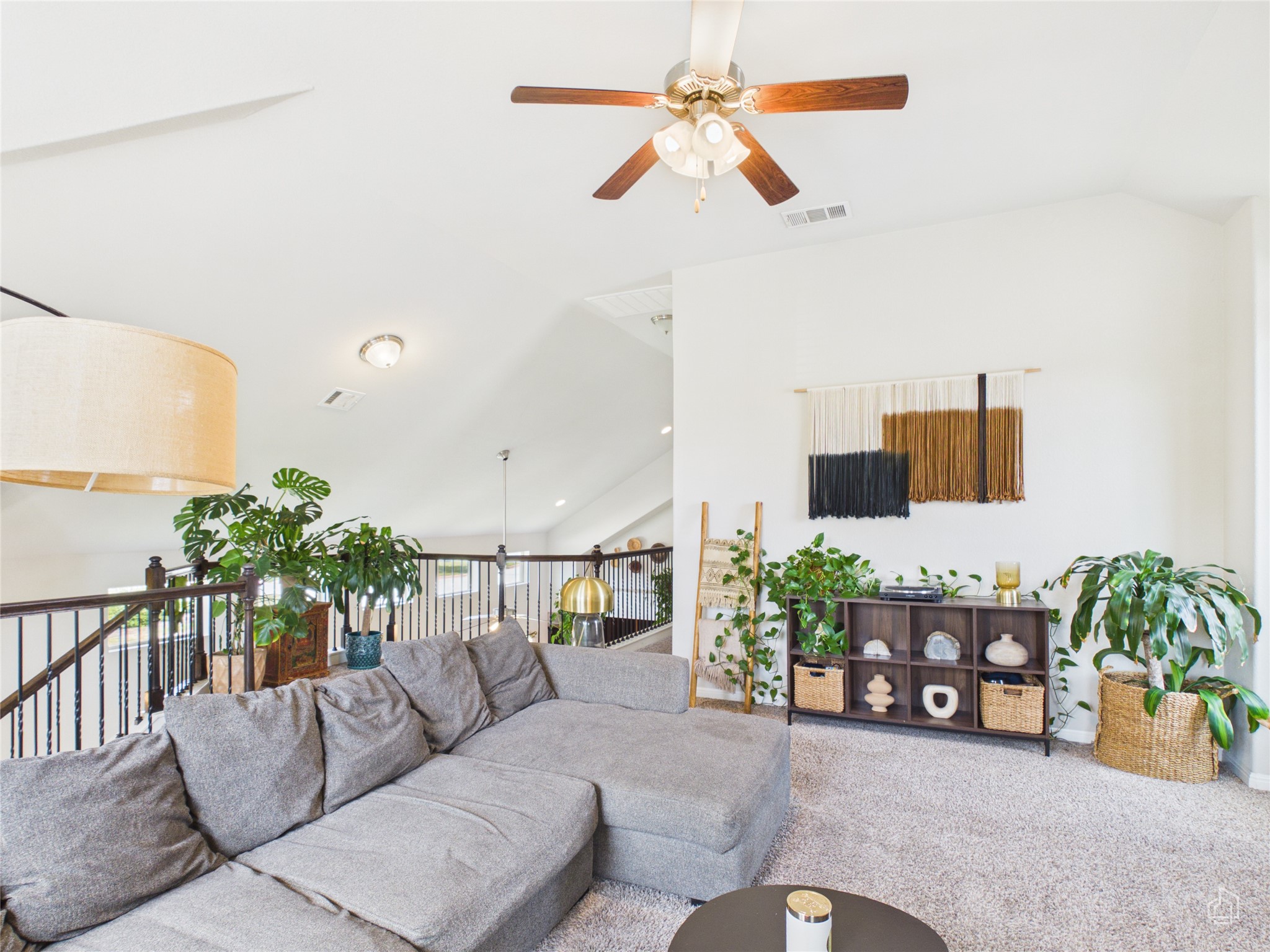 9310 Tanager Way Austin, TX 78748 - Photo 19 of 32 A spacious living area with soaring ceilings and a plush sectional sofa invites relaxation.