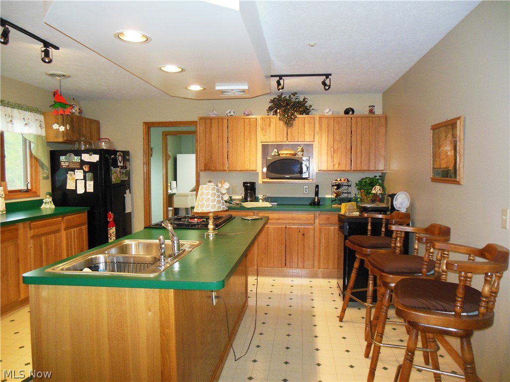 5207 Highway 46 Rome, OH 44085 - Photo 8 of 26 Roomy Kitchen with Island & great lighting package. Appliances stay.
