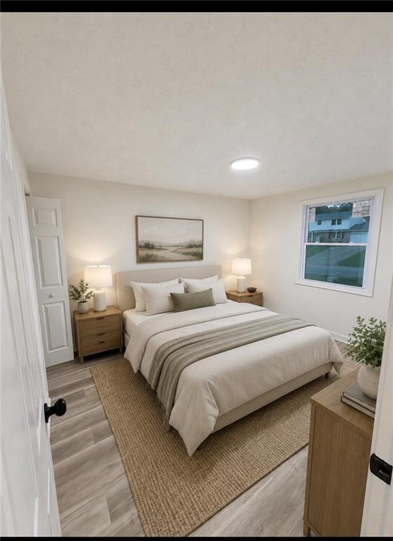6855 Kimberly Mill Road Atlanta, GA 30349 - Photo 5 of 11 a bedroom with a bed and a couch