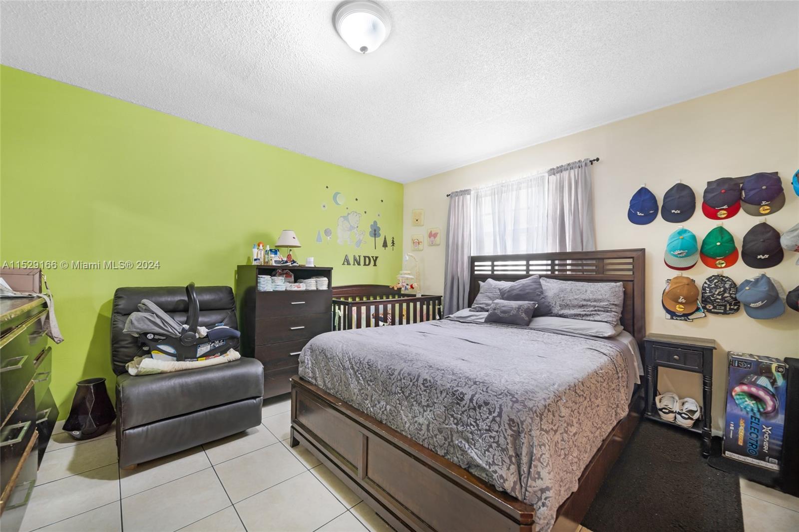 13240 Port Said Road Opa-Locka, FL 33054 - Photo 14 of 21 a bedroom with a bed and couch