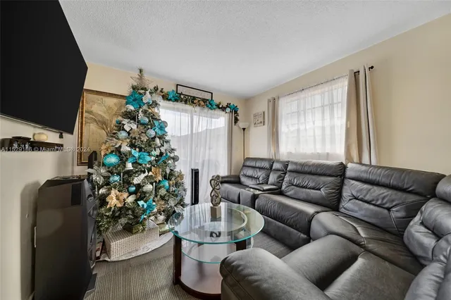 a bathroom with a sink toilet a mirror and shower