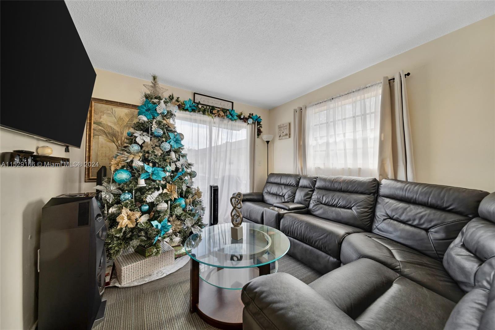 13240 Port Said Road Opa-Locka, FL 33054 - Photo 15 of 21 a living room with furniture a dining table and a potted plant