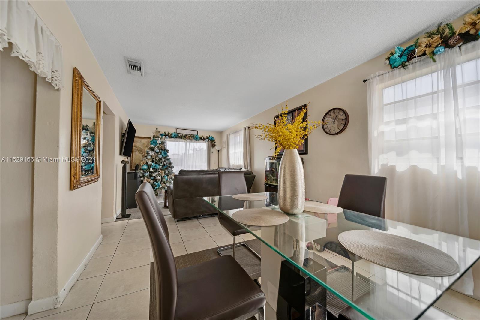 13240 Port Said Road Opa-Locka, FL 33054 - Photo 5 of 21 a dining room with furniture and window