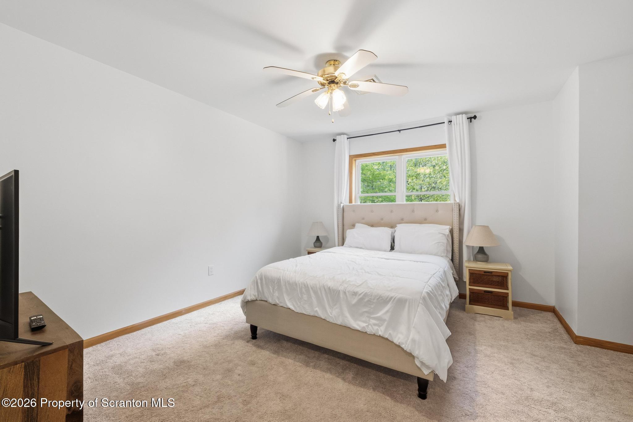 58 Bender Road Gouldsboro, PA 18424 - Photo 29 of 55 a bedroom with a bed and a window