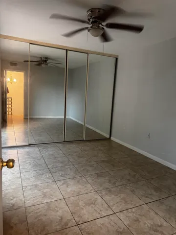 a view of an empty room with a bathroom