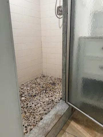 a bathroom with a double vanity sink mirror and toilet