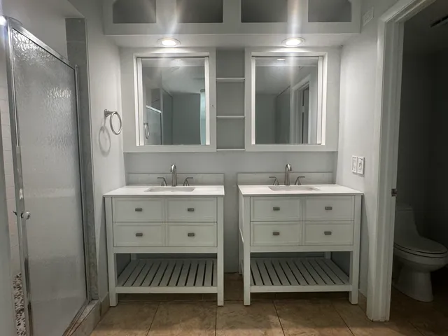 a view of a hallway with wooden shelves