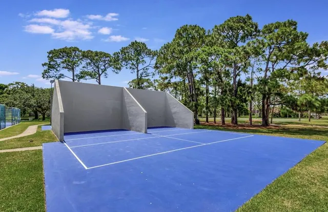 a white bath tub sitting in front of a house