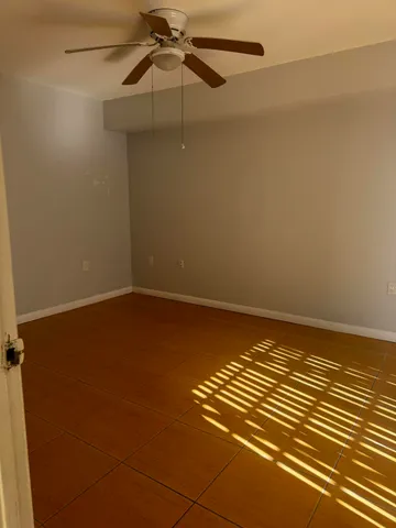 en empty room with wooden floor