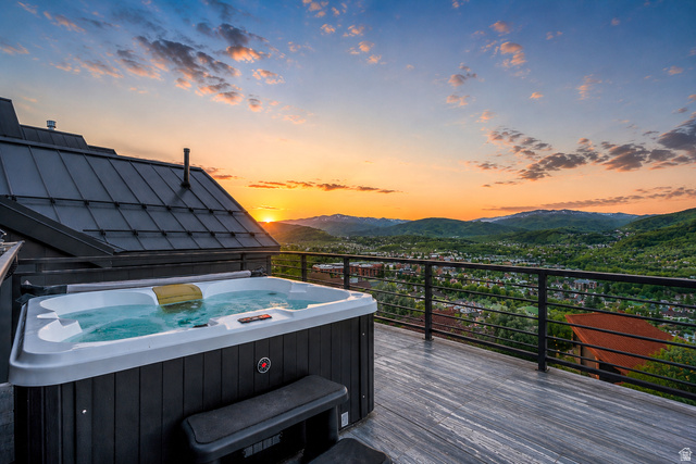 1258 Rothwell Road Park City, UT 84060 - Photo 2 of 48 Expansive outdoor deck featuring a hot tub, cable railing system, and grey wood-finish flooring
