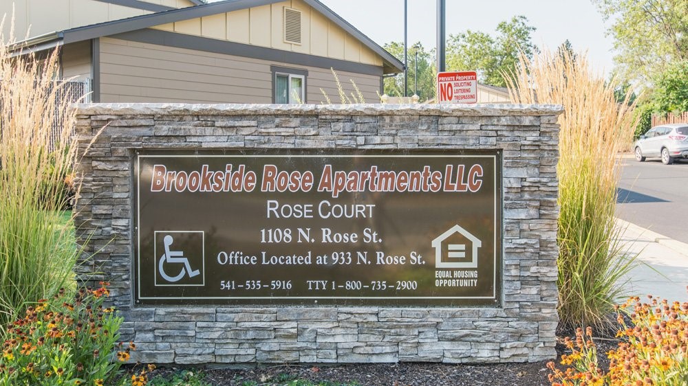 1108 South Rose Street, Unit 50 Phoenix, OR 97535 - Photo 7 of 10 a sign broad on the side of a building