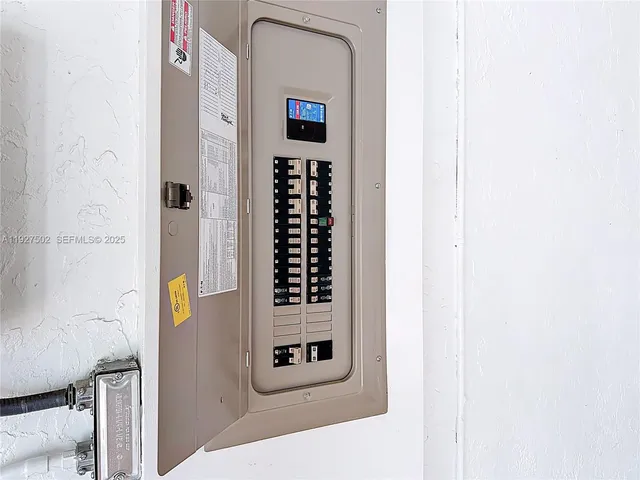 a bathroom with a toilet mirror and tub