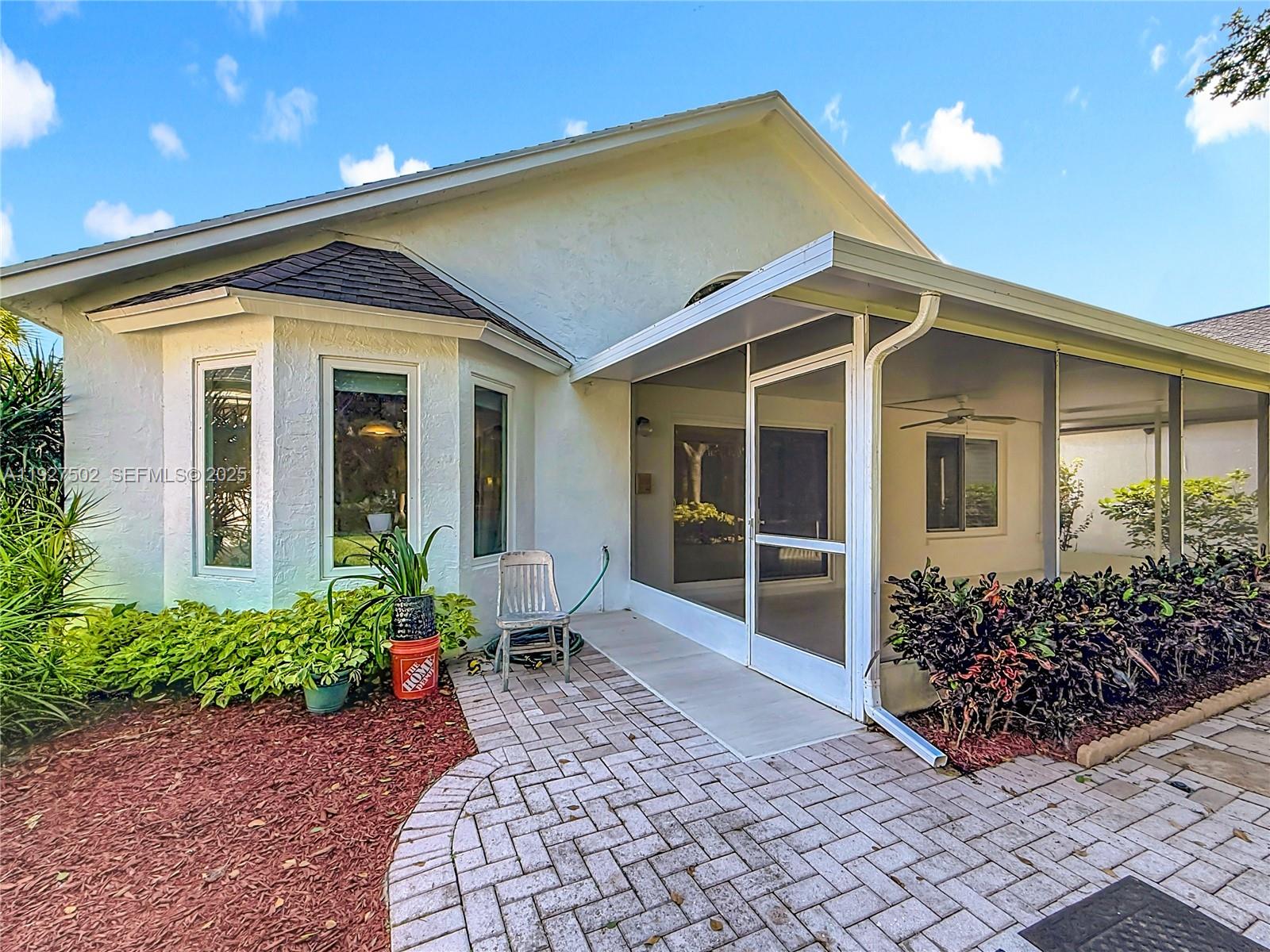 356 Hammocks Trail Greenacres, FL 33413 - Photo 33 of 41 a house with garden in front of it