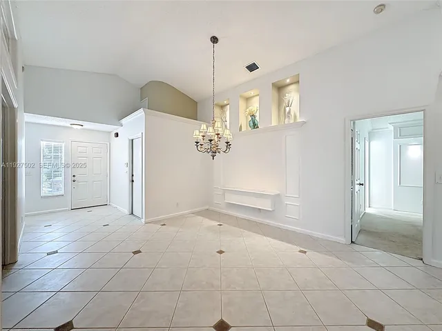 a view of a big room with closet and windows