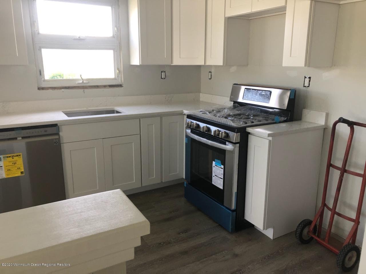 2 Higgins Court Brick, NJ 08724 - Photo 11 of 21 a kitchen with a stove and a sink