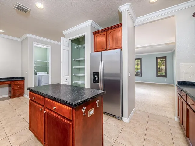 an empty room with windows and outdoor view