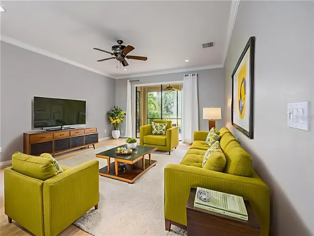 a view of a big room with closet and a chandelier fan