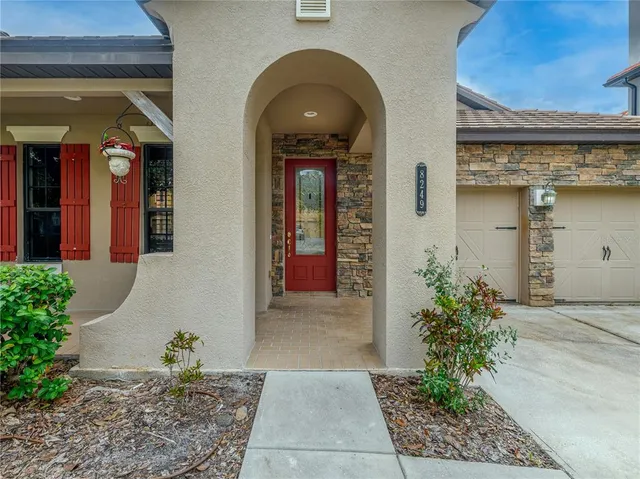 an aerial view of residential house with outdoor space and swimming pool