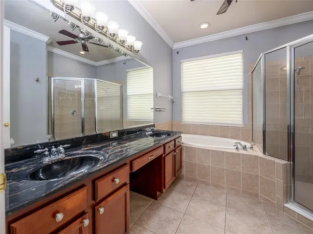 an aerial view of a house with a lake view