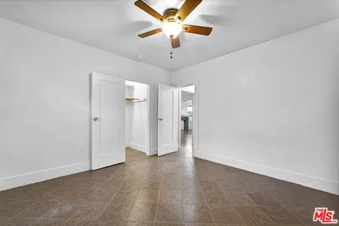 a bathroom with a sink vanity and a window