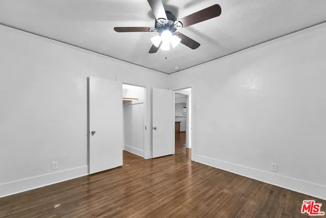 a bathroom with a double vanity sink a mirror and a bathtub