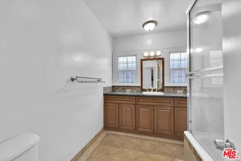 a bathroom with a tub and a shower