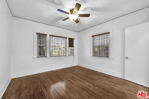a view of a house with porch and furniture