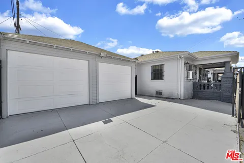 a view of a house with a street
