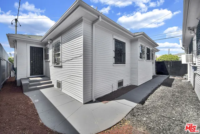 a view of a house next to a yard
