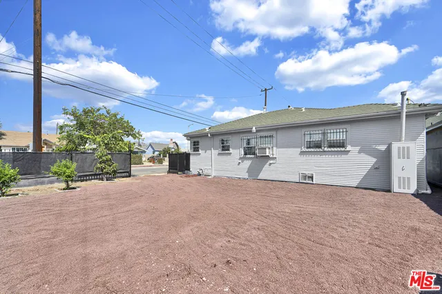 a picture of a bench in front of a wall