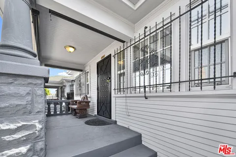 wooden floor in an empty room with a fireplace