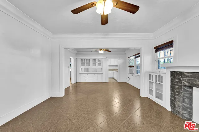 a kitchen that has a sink and cabinets