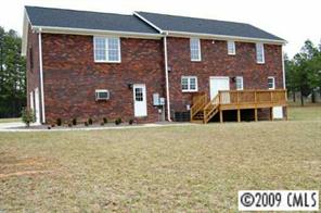 6250 Cress Road Concord, NC 28025 - Photo 3 of 8 a front view of a house with a yard