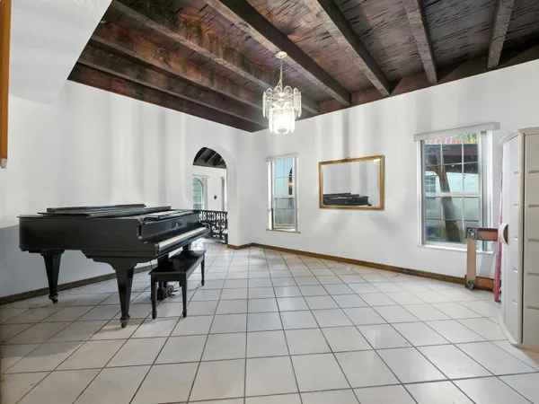 a room with gym equipment and a large window