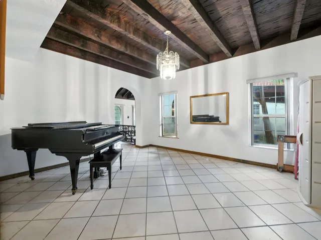 a room with gym equipment and a large window