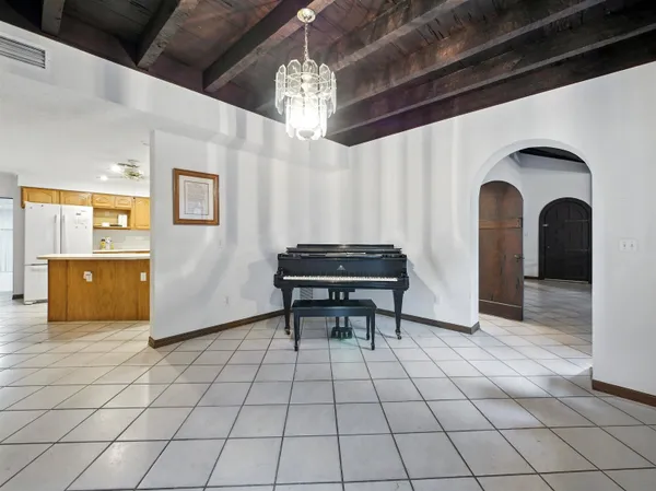 a view of entryway with a table and chairs