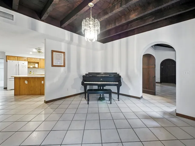 a view of entryway with a table and chairs