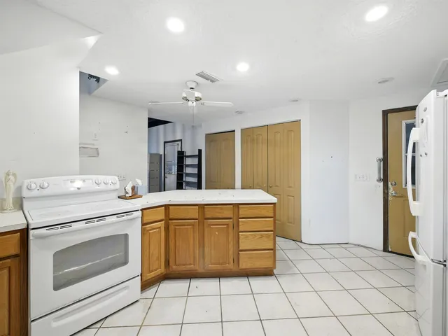 a kitchen that has a sink and a stove