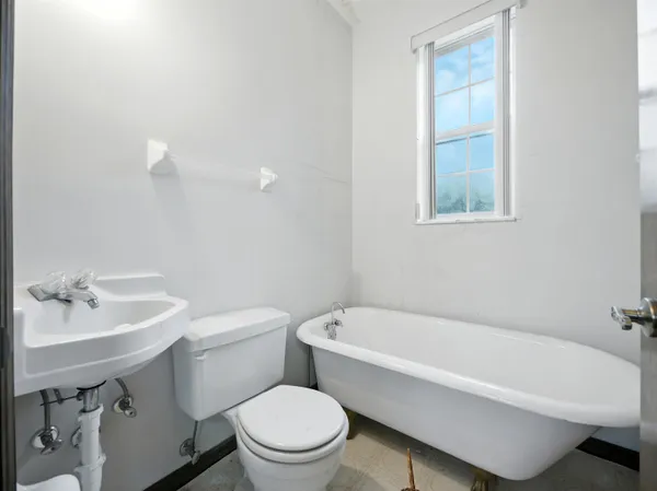 a bathroom with a sink toilet and bathtub