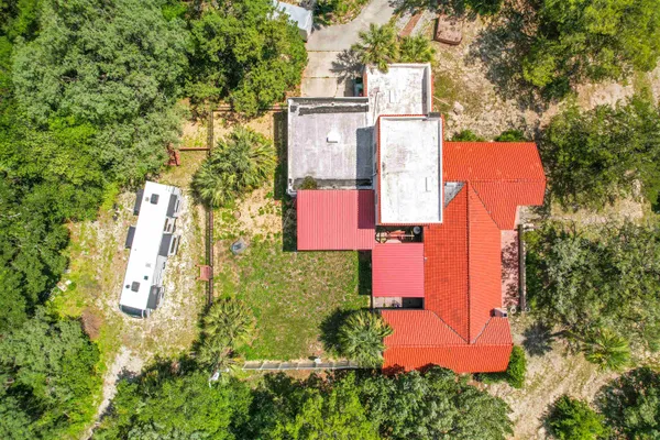 an aerial view of residential houses with outdoor space and street view